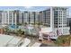 Modern condo building featuring a rooftop pool, colorful murals, and stylish architecture at 111 S Pineapple Ave # 813, Sarasota, FL 34236