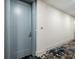 Hallway showing unit door with stylish carpeting, modern accents, and elevator access nearby at 111 S Pineapple Ave # 813, Sarasota, FL 34236
