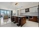 Bright kitchen with stainless steel appliances, a center island with seating, and modern cabinetry at 111 S Pineapple Ave # 813, Sarasota, FL 34236