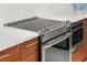 Close up of a modern kitchen featuring stainless steel cooktop, oven and microwave at 111 S Pineapple Ave # 813, Sarasota, FL 34236