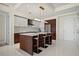 Bright kitchen featuring an island with bar stool seating, modern cabinetry, and stainless appliances at 111 S Pineapple Ave # 813, Sarasota, FL 34236