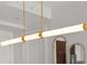 Contemporary kitchen light fixture with gold accents and modern design at 111 S Pineapple Ave # 813, Sarasota, FL 34236
