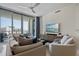 Bright living room with large windows leading to balcony, comfortable seating, and modern furnishings at 111 S Pineapple Ave # 813, Sarasota, FL 34236