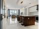 Open concept living space featuring a modern kitchen, dining and sitting area and light, reflective floors at 111 S Pineapple Ave # 813, Sarasota, FL 34236