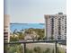 Scenic waterfront view from the condo, featuring boats, lush greenery and surrounding buildings at 111 S Pineapple Ave # 813, Sarasota, FL 34236