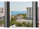 Scenic view from inside showcasing clear blue water and cityscape with sailboats at 111 S Pineapple Ave # 813, Sarasota, FL 34236