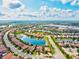 A tranquil neighborhood with houses by a lake, perfect for relaxing and enjoying the outdoors at 13112 Swiftwater Way, Bradenton, FL 34211