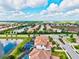 Beautiful aerial view of a neighborhood with tile roofs and private pools on a sunny day at 13112 Swiftwater Way, Bradenton, FL 34211