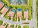 An overhead view reveals a neighborhood with pools, tile roofs and manicured lawns at 13112 Swiftwater Way, Bradenton, FL 34211