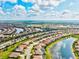 Aerial image displays a luxurious residential area featuring waterfront homes and private pools at 13112 Swiftwater Way, Bradenton, FL 34211