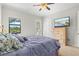 Comfortable primary bedroom features a ceiling fan, and outdoor access, perfect for relaxing at 13112 Swiftwater Way, Bradenton, FL 34211