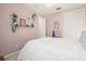 Cozy bedroom with soft colors, a plush bed, and decorated wall shelves at 13112 Swiftwater Way, Bradenton, FL 34211