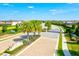 Aerial view of the community entrance, showcasing lush landscaping, gated entry, and well-maintained streets at 13112 Swiftwater Way, Bradenton, FL 34211