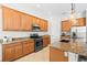 Well-equipped kitchen boasts granite countertops, stainless steel appliances, and ample cabinet space at 13112 Swiftwater Way, Bradenton, FL 34211
