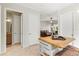 Kitchen island features stylish seating, storage shelves, and a wood countertop, adding functionality to the space at 13112 Swiftwater Way, Bradenton, FL 34211