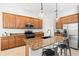 Kitchen island features seating, granite countertops, and stainless steel appliances at 13112 Swiftwater Way, Bradenton, FL 34211