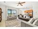 Bright living room features neutral colors, comfortable seating, and a view of the screened in patio at 13112 Swiftwater Way, Bradenton, FL 34211