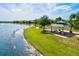Enjoy the beautiful lakeside pavilion with picnic tables and stone accents in this welcoming community at 13112 Swiftwater Way, Bradenton, FL 34211