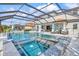 Stunning screened-in pool and spa area, perfect for relaxing or entertaining, with a covered patio and stylish lounge furniture at 13112 Swiftwater Way, Bradenton, FL 34211