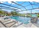 Stunning screened-in pool and spa with waterfall feature, perfect for relaxation and entertainment at 13112 Swiftwater Way, Bradenton, FL 34211