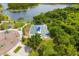 Aerial view featuring bocce ball courts, a playground, and scenic lakefront walking trails at 13169 Steinhatchee Loop, Venice, FL 34293