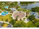 Aerial view showcases the community's playground, pavilion, and scenic lake, perfect for recreation and relaxation at 13169 Steinhatchee Loop, Venice, FL 34293