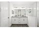 Modern bathroom featuring double sinks, quartz countertop, and seamless glass shower at 13169 Steinhatchee Loop, Venice, FL 34293