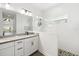 Modern bathroom with white subway tile, glass shower, and double sink vanity at 13169 Steinhatchee Loop, Venice, FL 34293