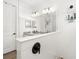 Bright bathroom with stylish fixtures, white tile, and a frameless glass shower at 13169 Steinhatchee Loop, Venice, FL 34293