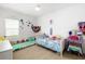 room with whimsical decor, colorful plushies, and bright natural light at 13169 Steinhatchee Loop, Venice, FL 34293