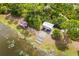 Aerial view of a kayak/canoe launch featuring rack storage on the shoreline of a tranquil lake at 13169 Steinhatchee Loop, Venice, FL 34293