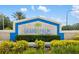 Community entrance sign for Grand Palm by Neal Communities with lush landscaping at 13169 Steinhatchee Loop, Venice, FL 34293