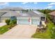 Beautiful two-story home featuring a two-car garage and manicured landscaping at 13169 Steinhatchee Loop, Venice, FL 34293