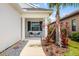Cozy front porch with two chairs and table, perfect for enjoying the outdoors at 13169 Steinhatchee Loop, Venice, FL 34293