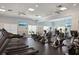 Well-equipped gym with modern treadmills, elliptical machines, and ceiling fans for a complete fitness experience at 13169 Steinhatchee Loop, Venice, FL 34293