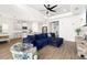 Open concept living room with backyard access, flowing into kitchen and dining area for a harmonious living experience at 13169 Steinhatchee Loop, Venice, FL 34293
