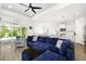 Bright and airy living room that seamlessly flows into an open kitchen and dining area with backyard views at 13169 Steinhatchee Loop, Venice, FL 34293
