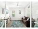 Bright home office featuring a comfortable sofa, a TV, and plenty of natural light at 13169 Steinhatchee Loop, Venice, FL 34293