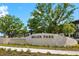 Wellen Park sign made of stone with a water feature and surrounded by landscaping in front of residential building at 13169 Steinhatchee Loop, Venice, FL 34293