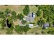 Sprawling property featuring a large home with a pool, pond, and lush landscaping at 140 Cowpen Ln, Sarasota, FL 34240