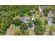 Aerial view of a private estate featuring a pool, long driveway, and mature trees at 140 Cowpen Ln, Sarasota, FL 34240