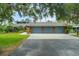 Charming single-Gathering home with a spacious three-car garage and well-manicured lawn at 140 Cowpen Ln, Sarasota, FL 34240