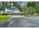 Charming single-Gathering home with a spacious three-car garage and a long driveway at 140 Cowpen Ln, Sarasota, FL 34240