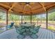 Inviting gazebo features comfortable seating, ideal for outdoor entertaining and relaxation at 140 Cowpen Ln, Sarasota, FL 34240