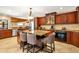 Open concept kitchen with granite countertops, a kitchen island, and stainless steel appliances at 140 Cowpen Ln, Sarasota, FL 34240