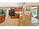 Spacious kitchen with granite countertops, stainless steel appliances, and pool views at 140 Cowpen Ln, Sarasota, FL 34240
