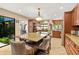Bright, open kitchen features a large central island, stainless appliances, and backyard access at 140 Cowpen Ln, Sarasota, FL 34240