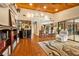 Open floor plan between living room and kitchen with wood floors and view to the outdoor space at 140 Cowpen Ln, Sarasota, FL 34240