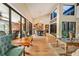 Spacious living room featuring hardwood floors, large windows, and open floor plan at 140 Cowpen Ln, Sarasota, FL 34240