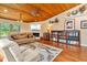 Spacious living room featuring wood floors, a fireplace, and stylish decor at 140 Cowpen Ln, Sarasota, FL 34240